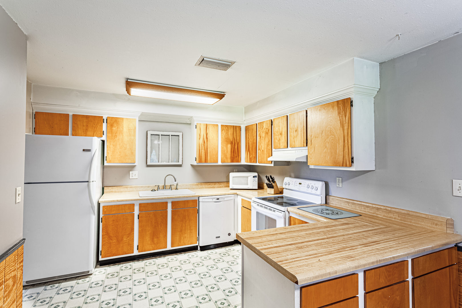 16176 Strawberry Road Morrison, IL 61270 - Photo 8 of 42 a kitchen with a sink a stove and refrigerator