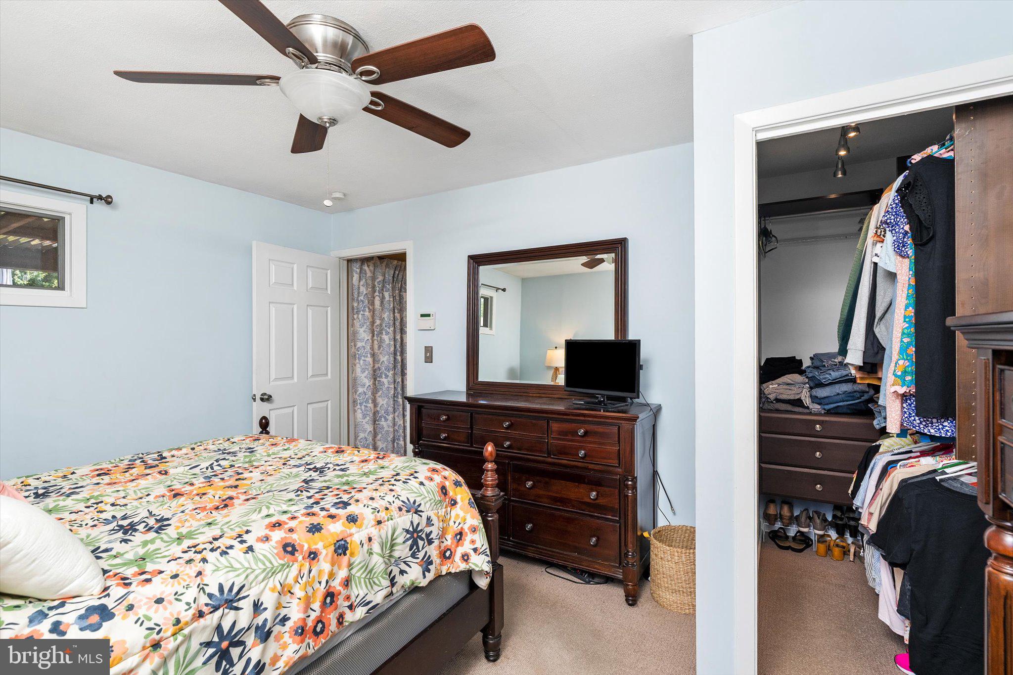 15 Decou Avenue Ewing, NJ 08628 - Photo 18 of 33 a bedroom with a bed and a flat tv screen on dresser