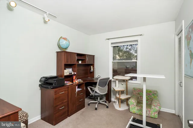a view of a workspace with furniture