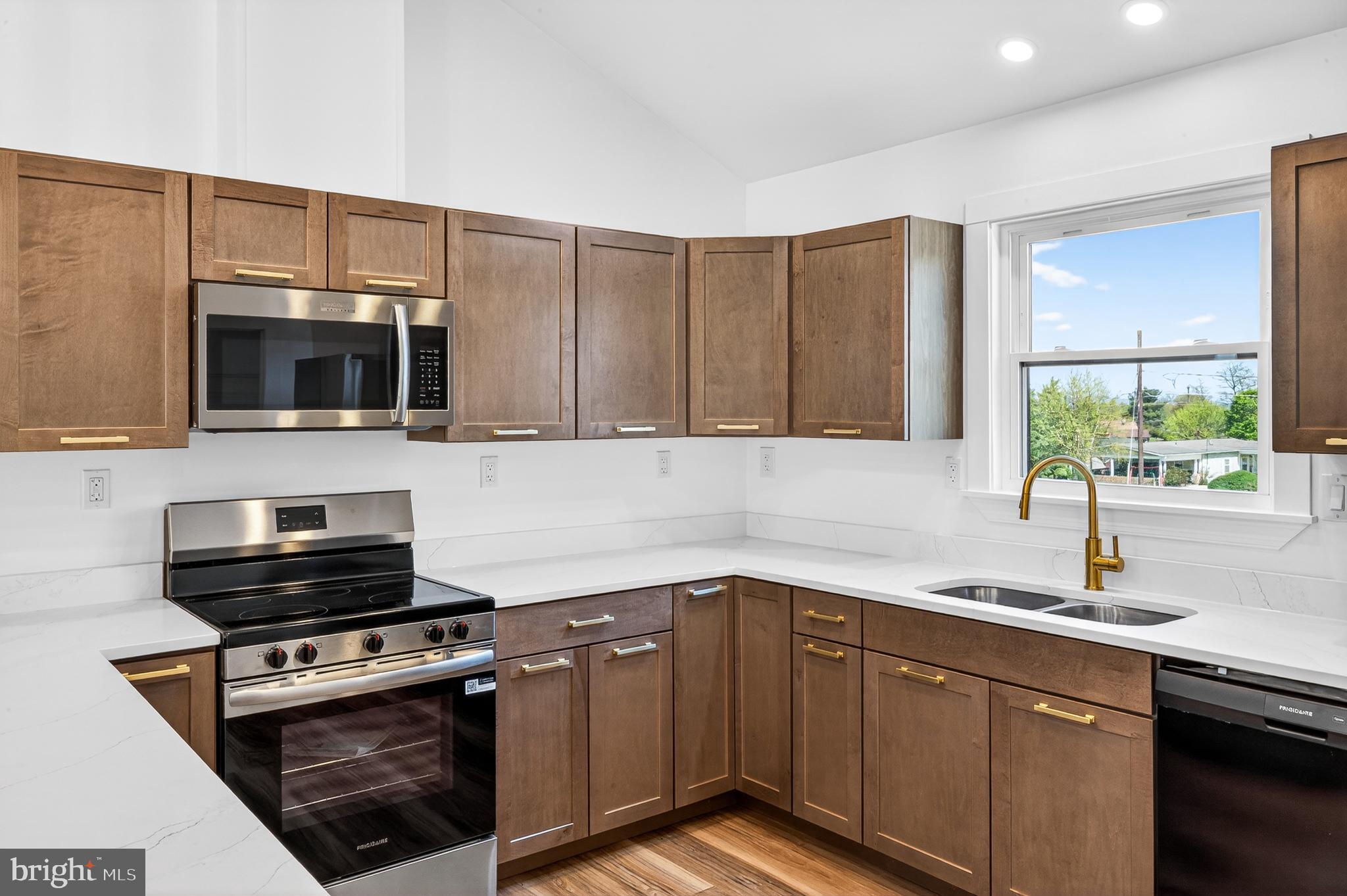 551 Park Road Stanley, VA 22851 - Photo 13 of 83 a kitchen with a sink a stove and microwave