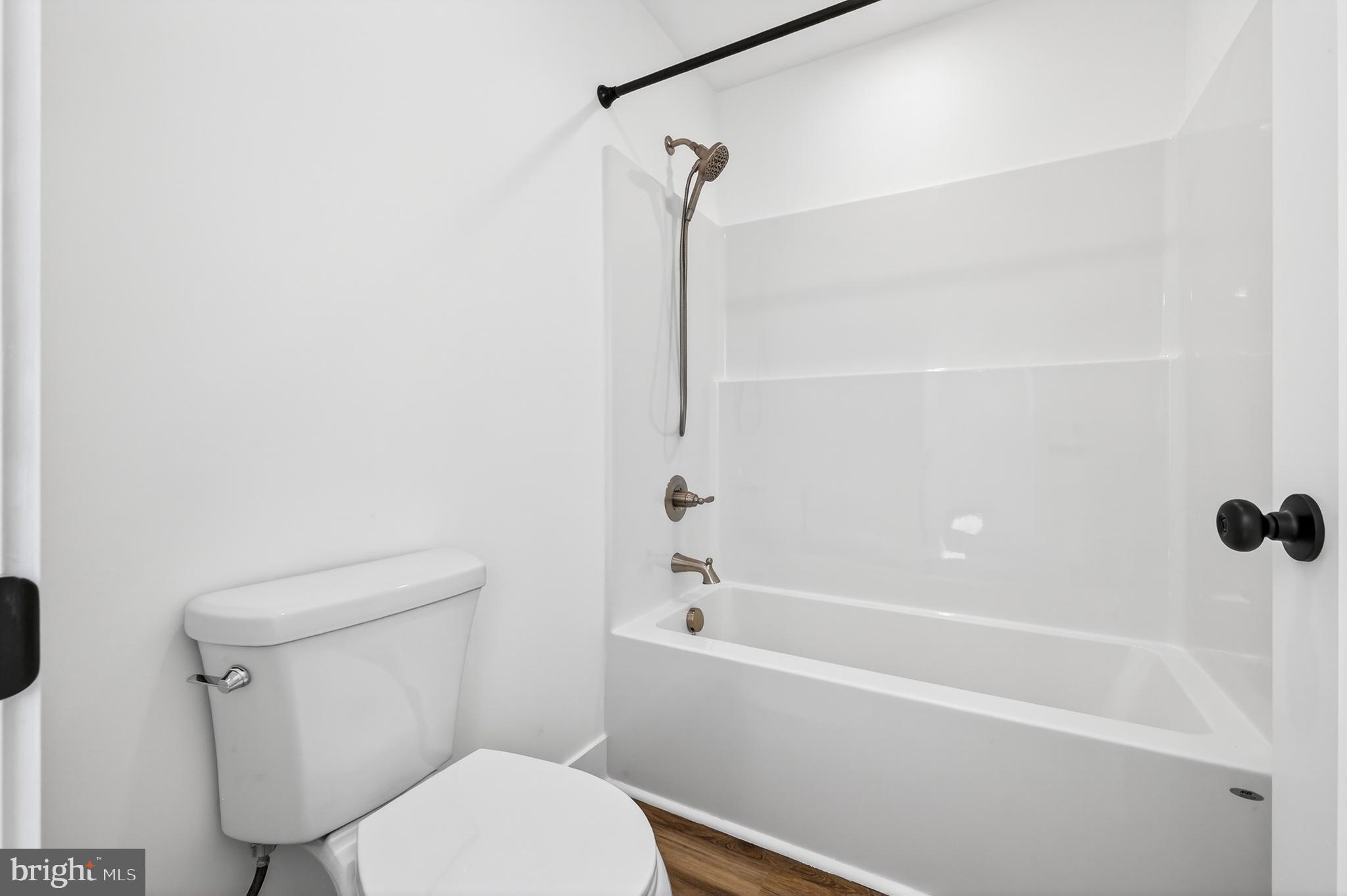 551 Park Road Stanley, VA 22851 - Photo 37 of 83 a white toilet sitting next to a bath tub