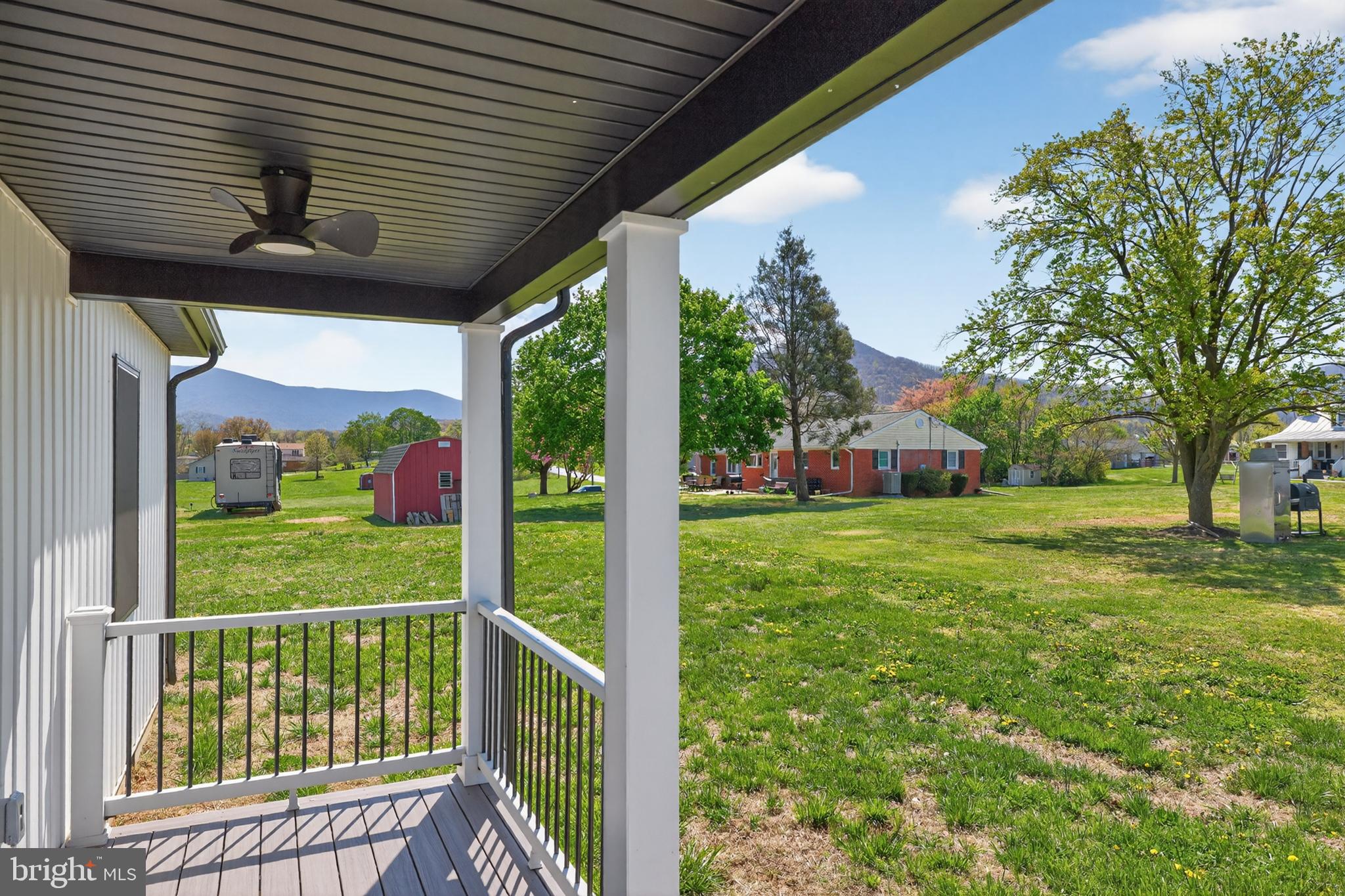 551 Park Road Stanley, VA 22851 - Photo 55 of 83 a view of a porch with a big yard potted plants and large tree