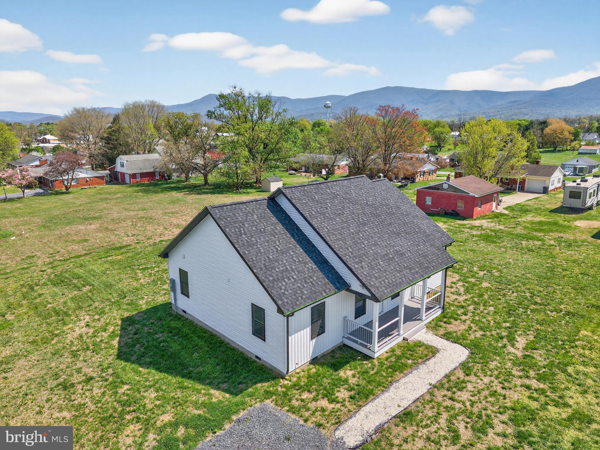 551 Park Road Stanley, VA 22851 - Photo 60 of 83 a aerial view of a house with a yard table and chairs