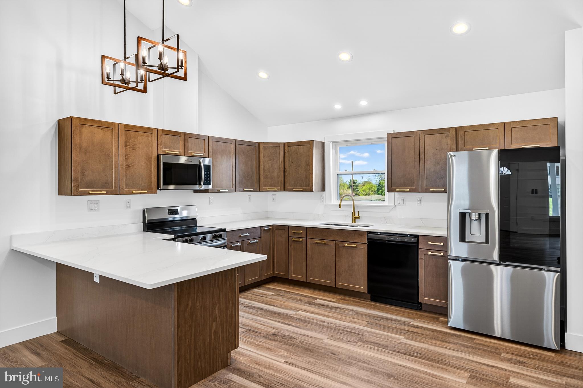551 Park Road Stanley, VA 22851 - Photo 7 of 83 a kitchen with kitchen island granite countertop stainless steel appliances cabinets a sink and a counter top space
