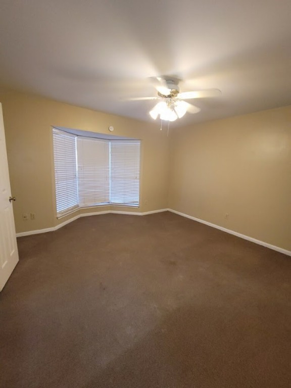 2529 Rio Grande Street, Unit 20 Austin, TX 78705 - Photo 11 of 19 an empty room with windows and fan