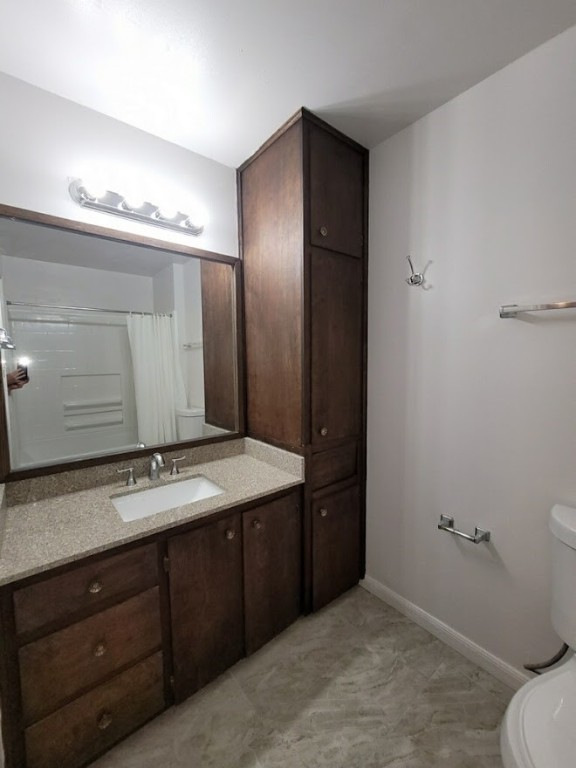 2529 Rio Grande Street, Unit 20 Austin, TX 78705 - Photo 17 of 19 a bathroom with a sink and a mirror