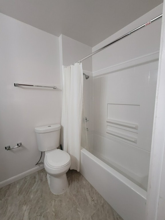 2529 Rio Grande Street, Unit 20 Austin, TX 78705 - Photo 19 of 19 a bathroom with a toilet and a shower