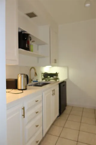 a kitchen with a sink and cabinets