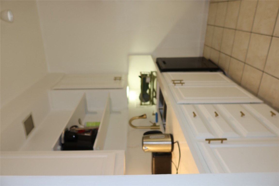 2529 Rio Grande Street, Unit 20 Austin, TX 78705 - Photo 5 of 19 a kitchen with a sink and cabinets