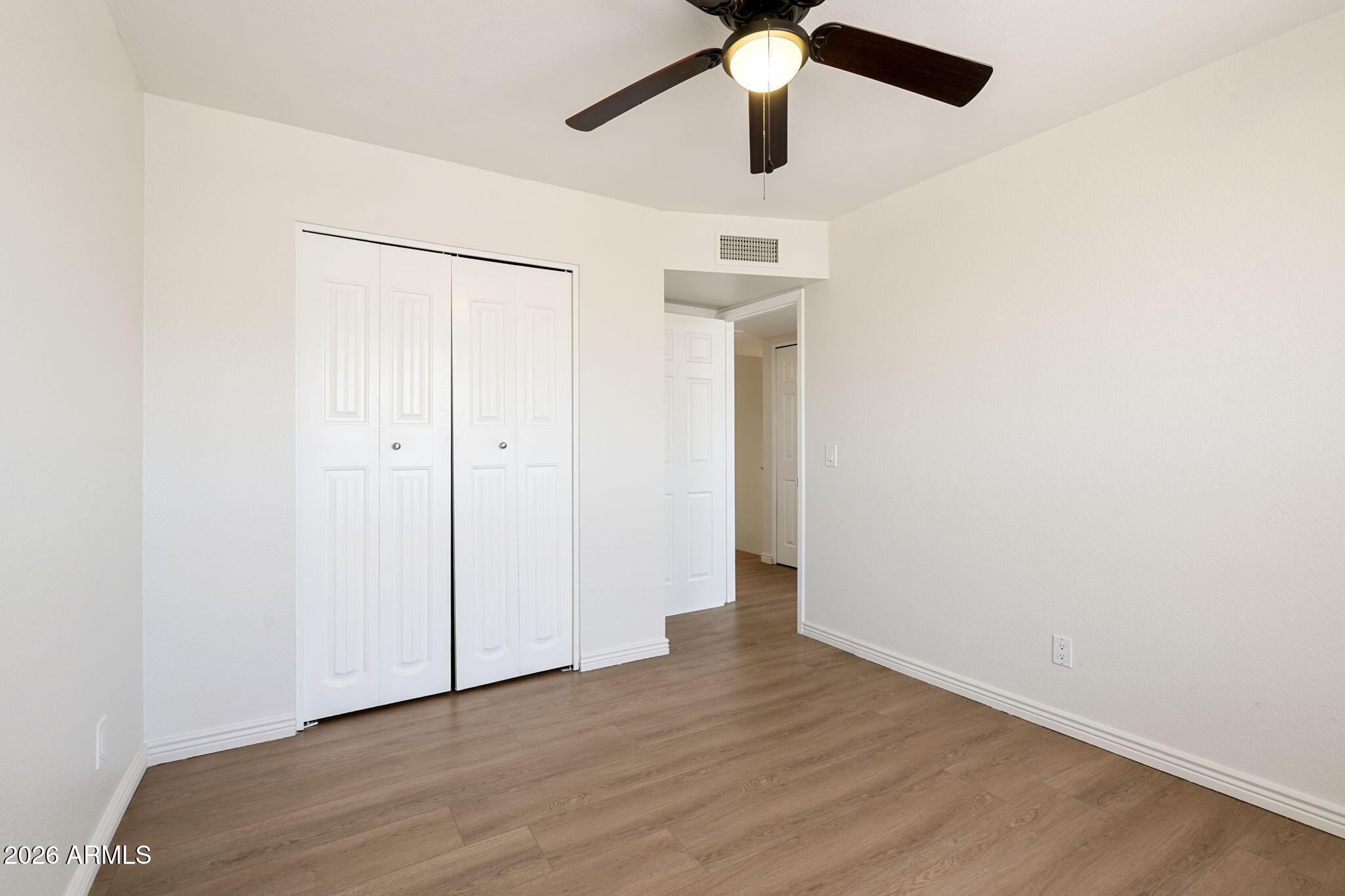 620 East Appaloosa Road Gilbert, AZ 85296 - Photo 22 of 45 an empty room with a ceiling fan and a fan