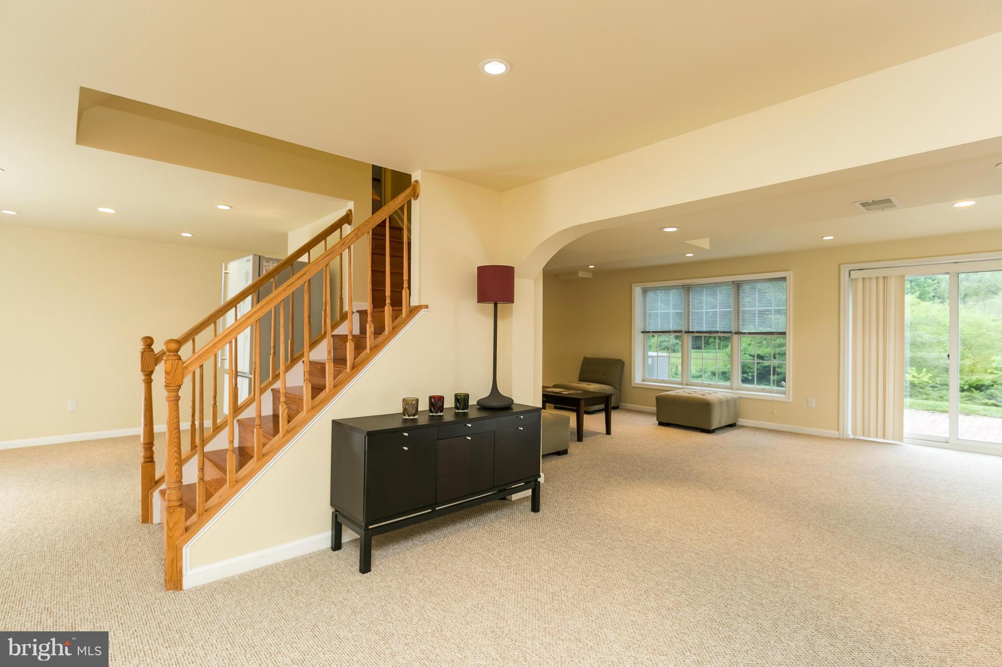 5052 Jericho Road Columbia, MD 21044 - Photo 23 of 30 Day light Basement,hardwood stairs