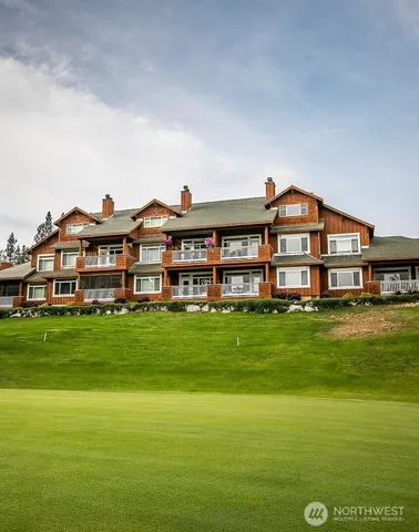 a view of a big room with a big yard and large trees
