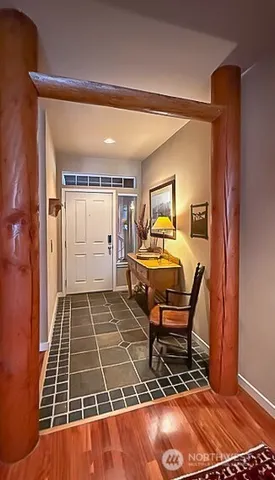 a living room with furniture and a rug