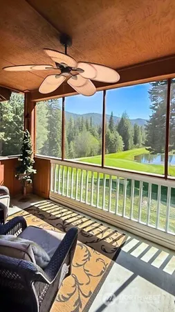 a very nice looking room with a large window and a table