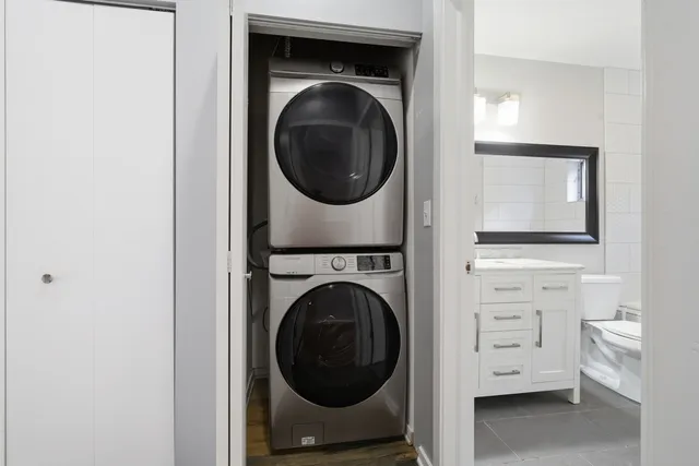 a view of a storage & utility room with a washer dryer