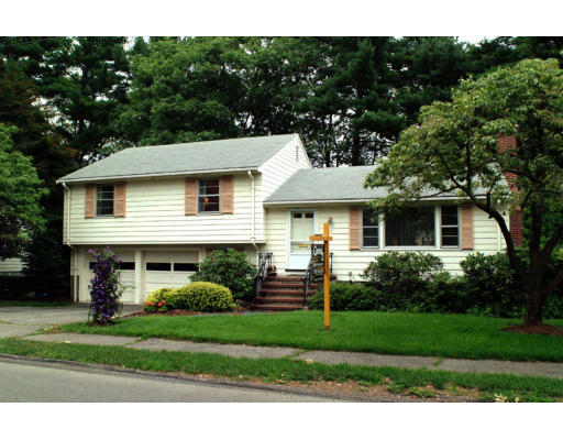 57 Tudor Road Needham, MA 02492 - Photo 1 of 4 a front view of a house with a yard