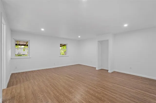 a view of room with wooden floor and window