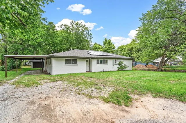 a front view of a house with yard
