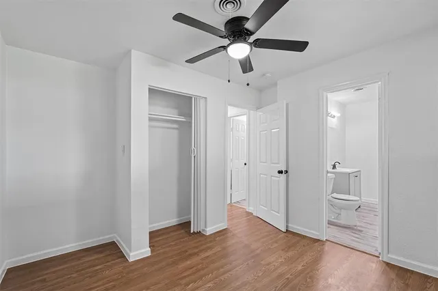 a view of an empty room and wooden floor