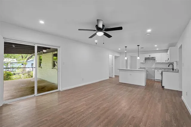 a view of kitchen with wooden floor and window