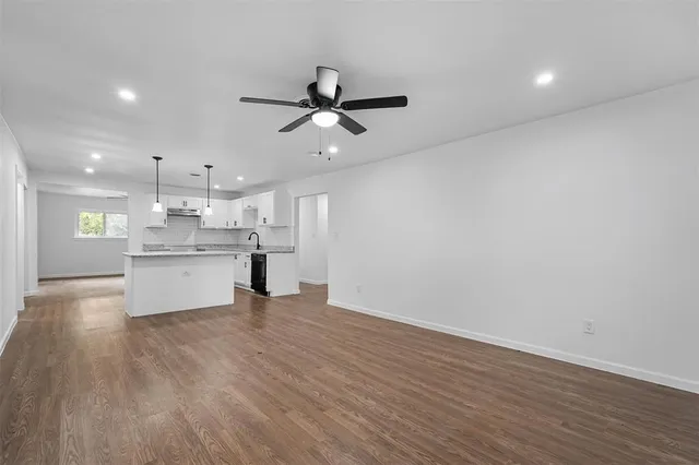 a view of kitchen with wooden floor and window