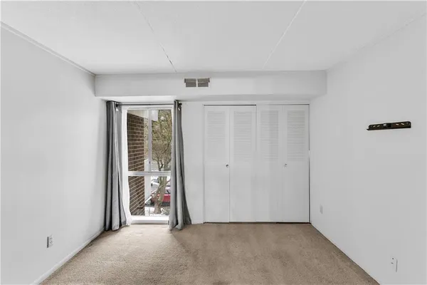 a bathroom with a toilet and a shower curtain