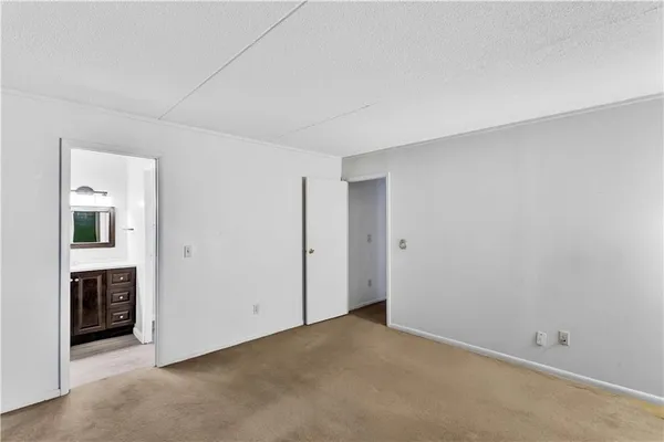 a bathroom with a shower sink and mirror