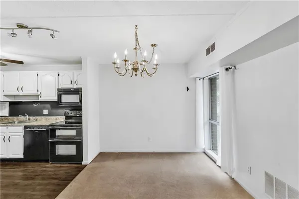 a view of kitchen and kitchen with sink
