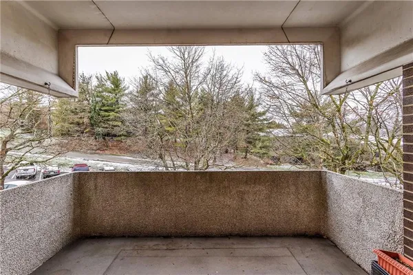 a view of an empty room with glass door