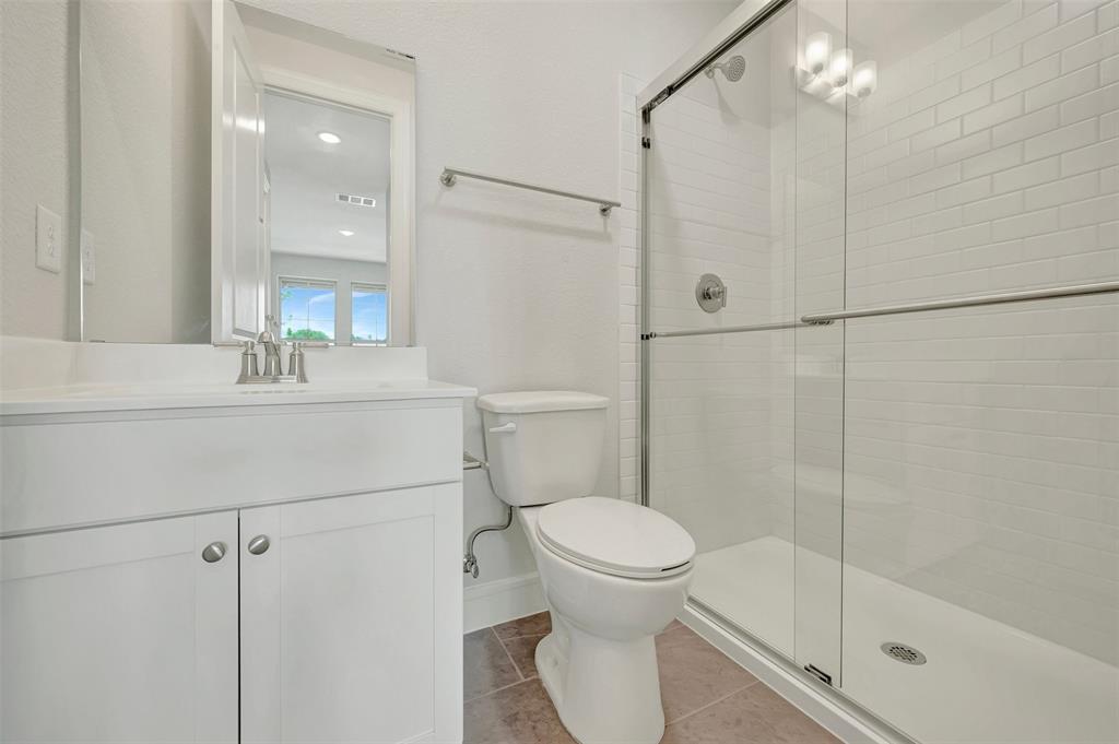 11460 Wulstone Road Fort Worth, TX 76052 - Photo 25 of 40 a bathroom with a sink toilet and shower