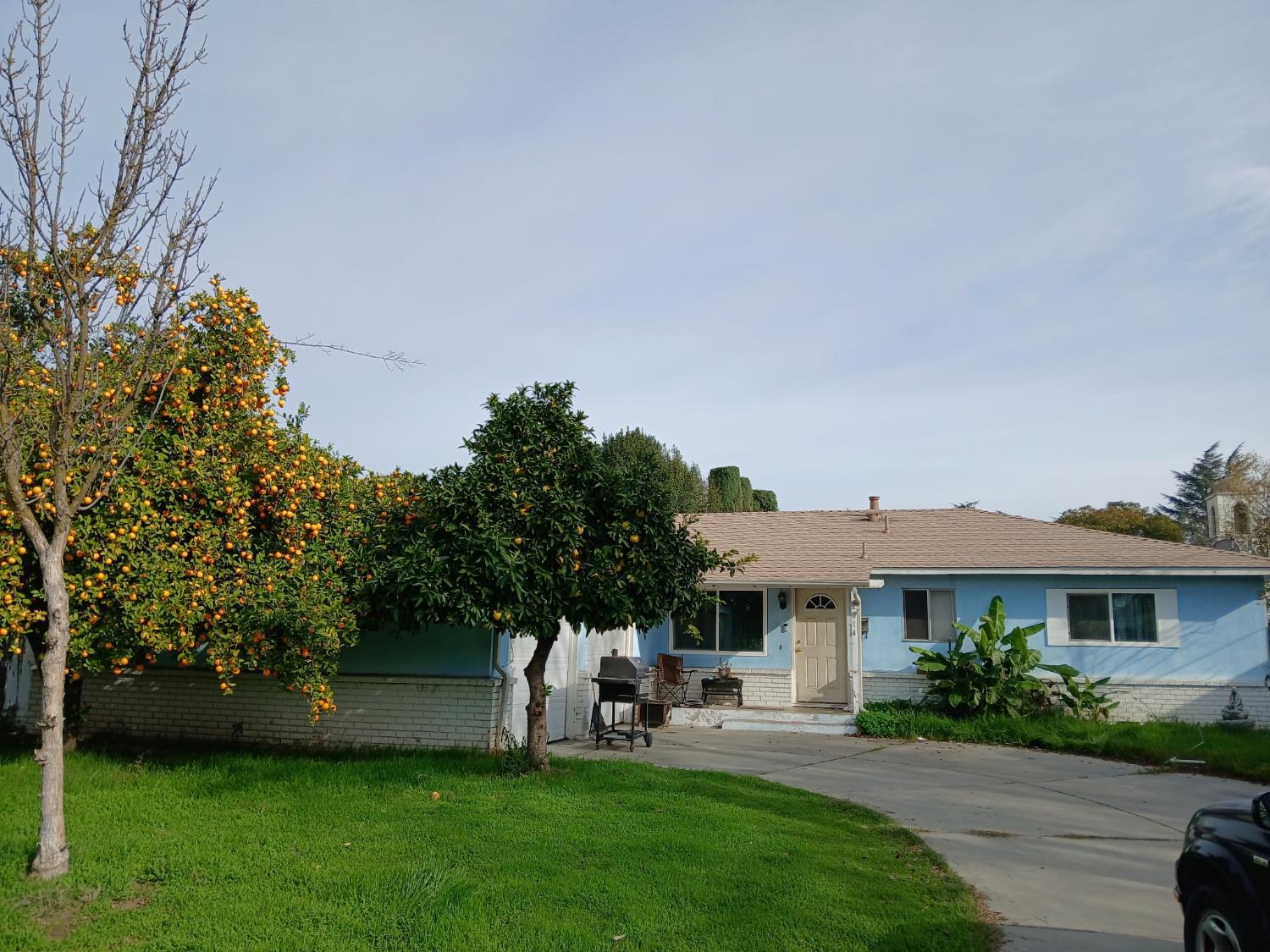 2014 Codding Drive Modesto, CA 95350 - Photo 2 of 3 a front view of a house with a garden and plants