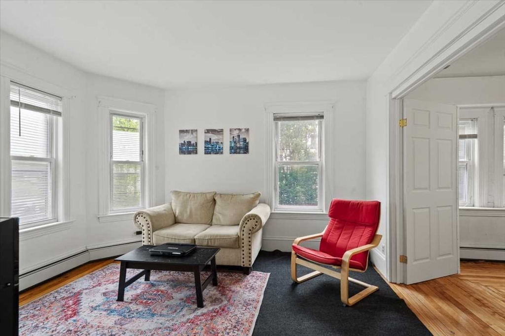 3 Wallace Street Worcester, MA 01605 - Photo 5 of 29 a living room with furniture a rug and a window