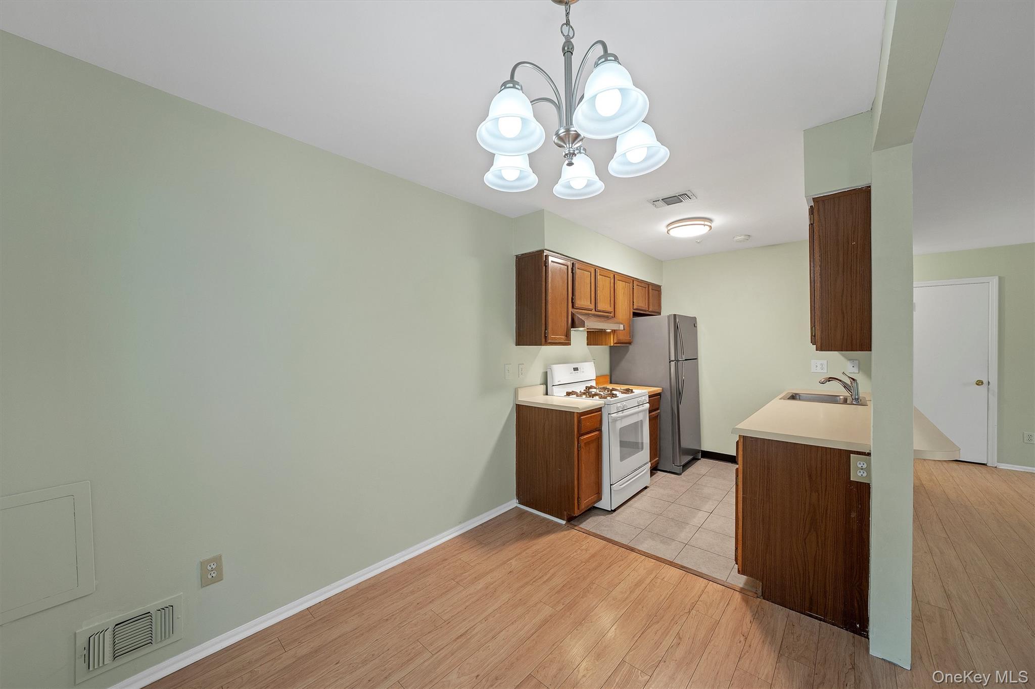 29 The Rise Warwick, NY 10990 - Photo 11 of 28 a view of kitchen and chandelier