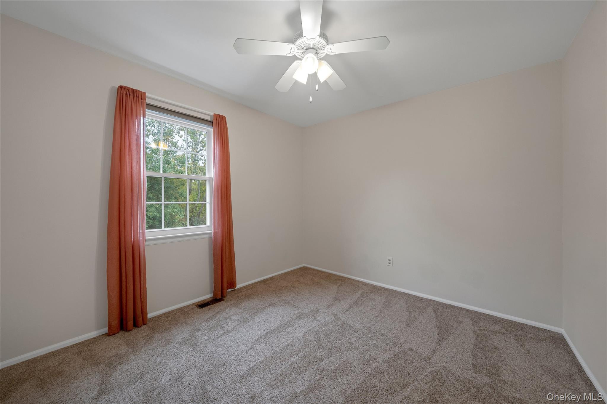 29 The Rise Warwick, NY 10990 - Photo 18 of 28 an empty room with windows and fan