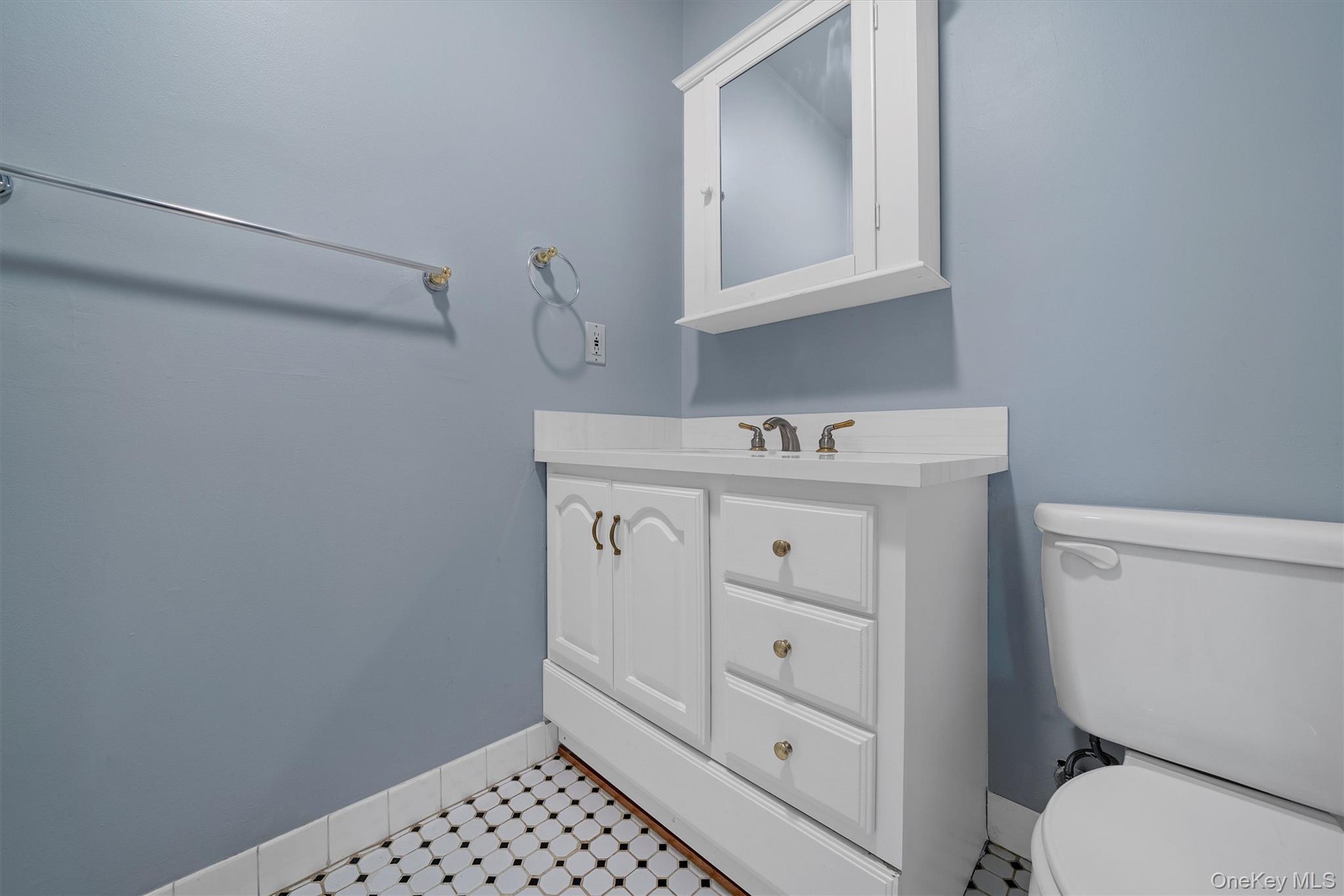 29 The Rise Warwick, NY 10990 - Photo 20 of 28 a bathroom with a sink a toilet and a mirror