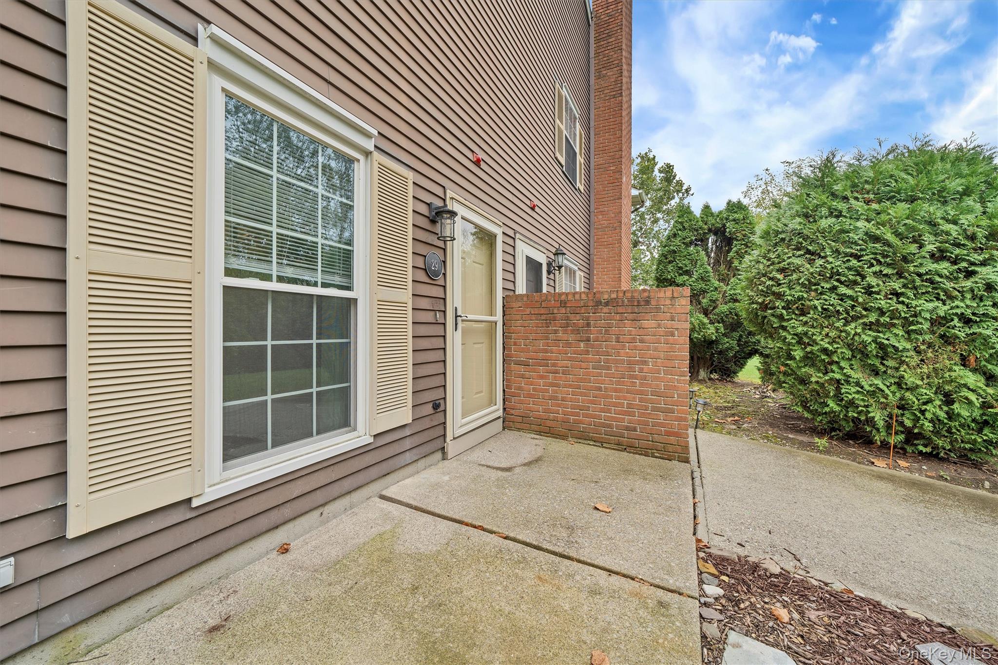 29 The Rise Warwick, NY 10990 - Photo 26 of 28 a view of a house with a yard and garage