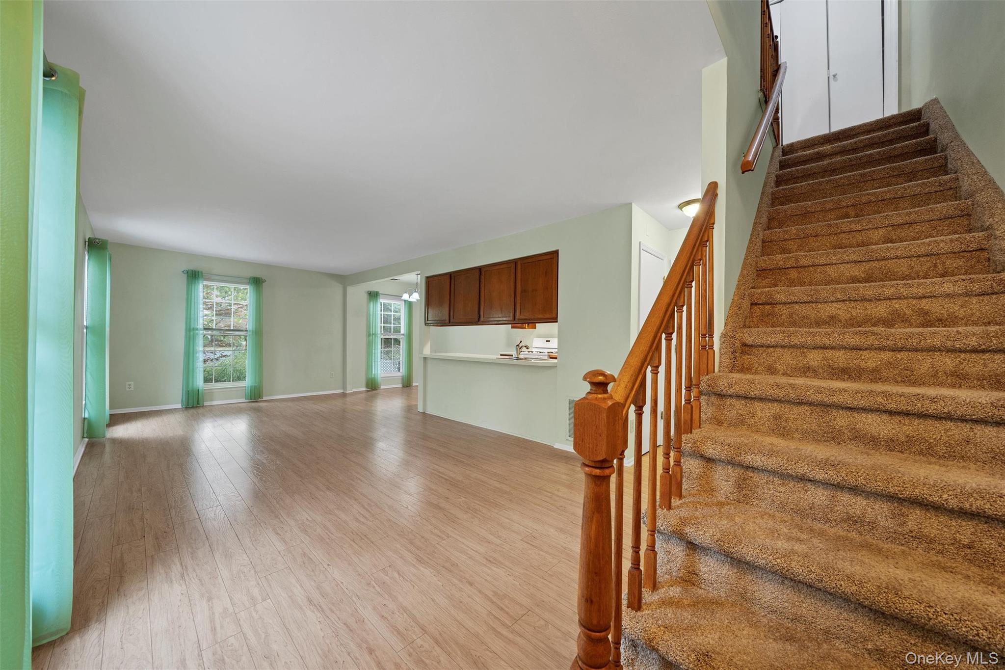 29 The Rise Warwick, NY 10990 - Photo 4 of 28 a view of an entryway with wooden floor and stairs