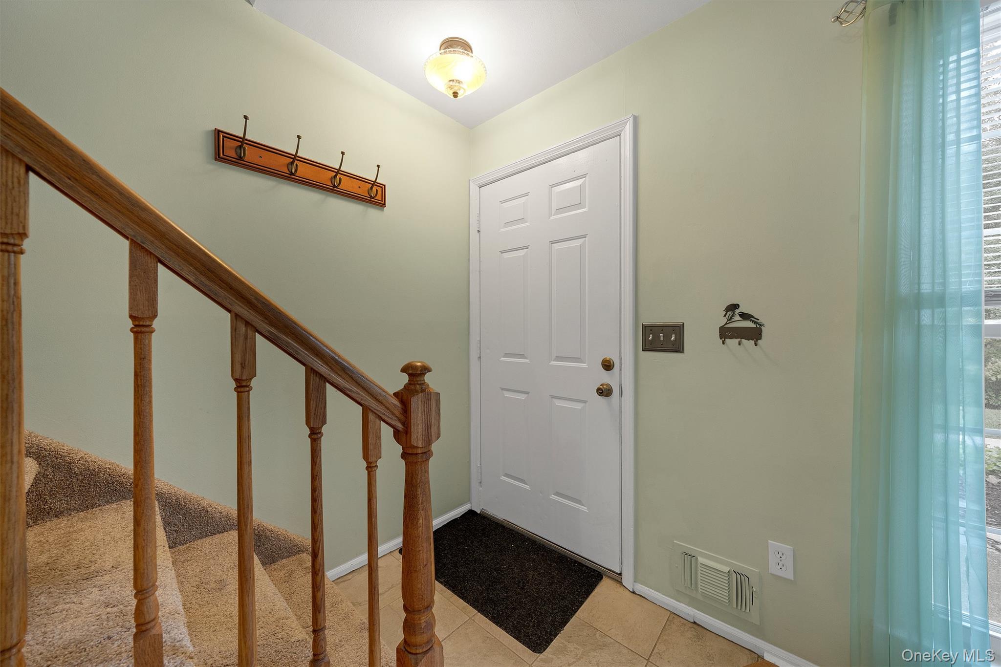 29 The Rise Warwick, NY 10990 - Photo 5 of 28 a view of entryway with stairs and wooden floor