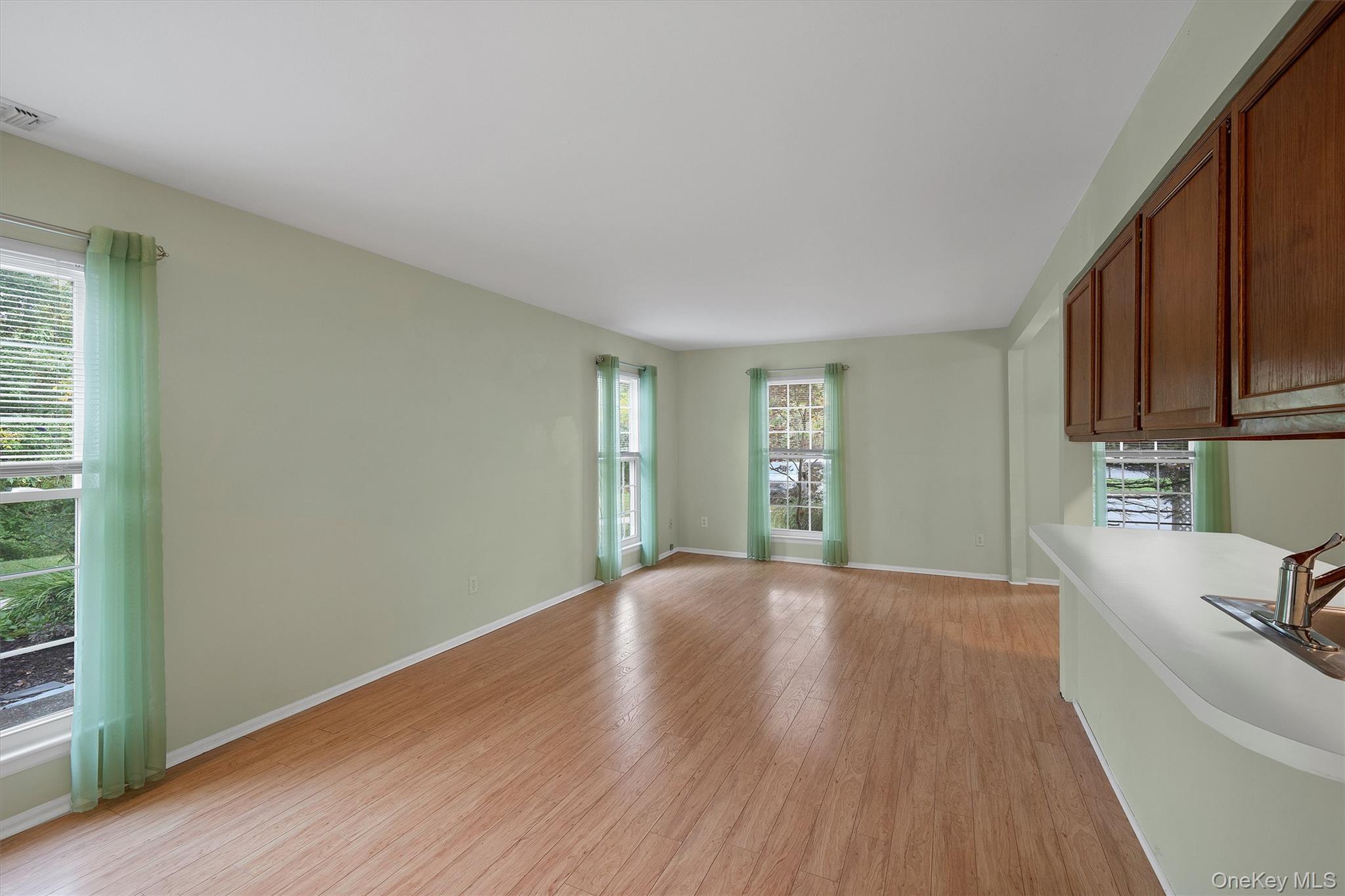 29 The Rise Warwick, NY 10990 - Photo 6 of 28 a view of a kitchen with wooden floor and electronic appliances
