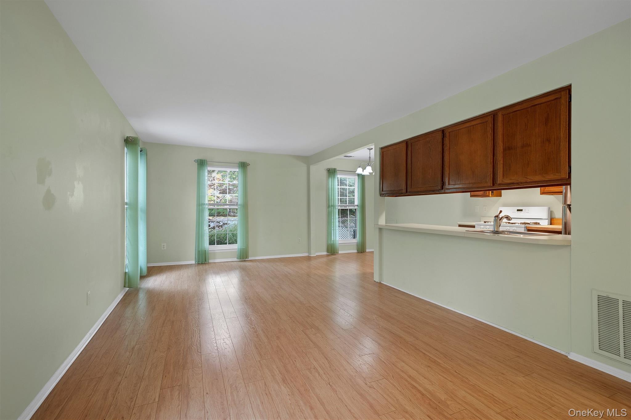 29 The Rise Warwick, NY 10990 - Photo 7 of 28 a view of kitchen with wooden floor and electronic appliances