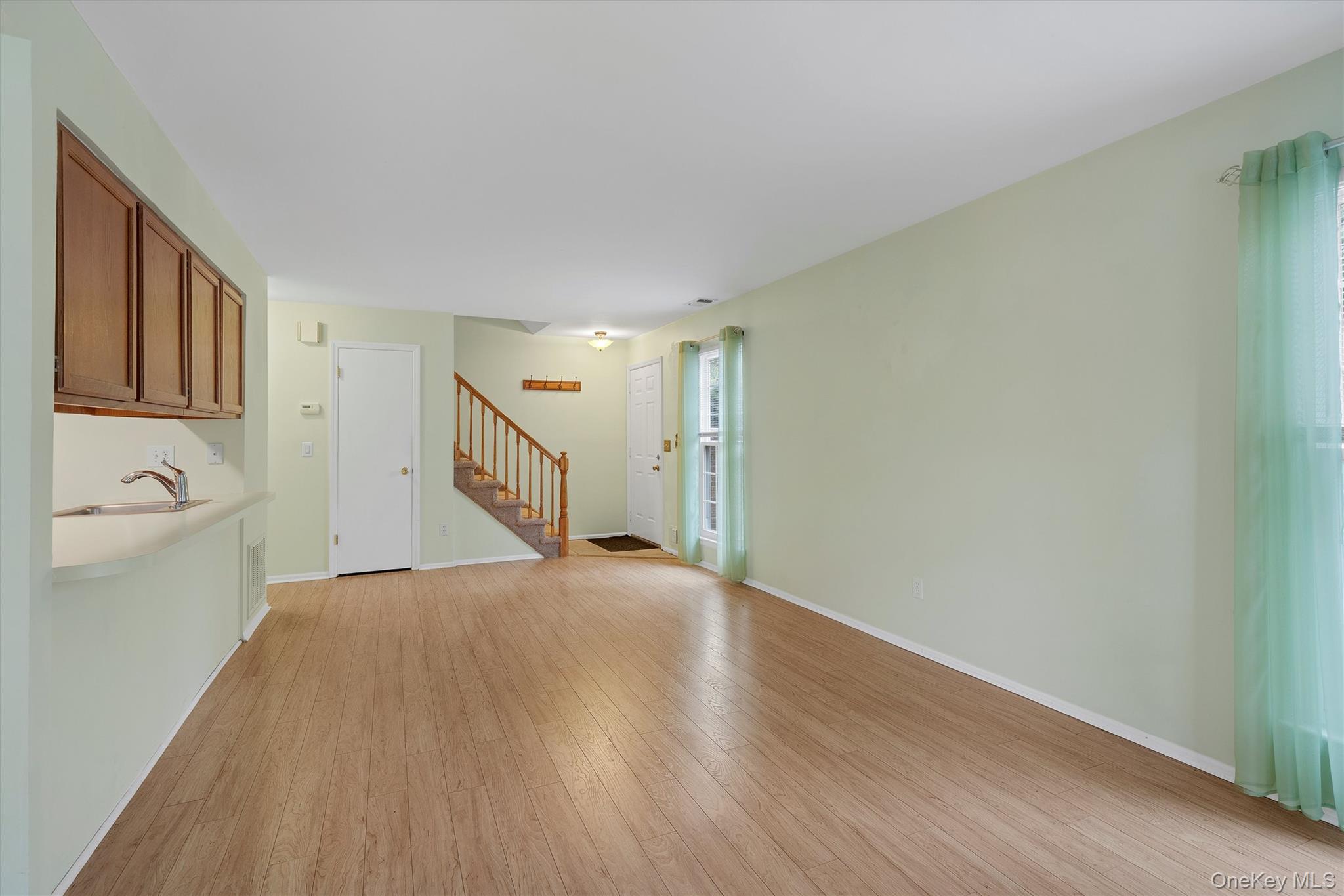 29 The Rise Warwick, NY 10990 - Photo 9 of 28 a view of empty room with wooden floor and fan