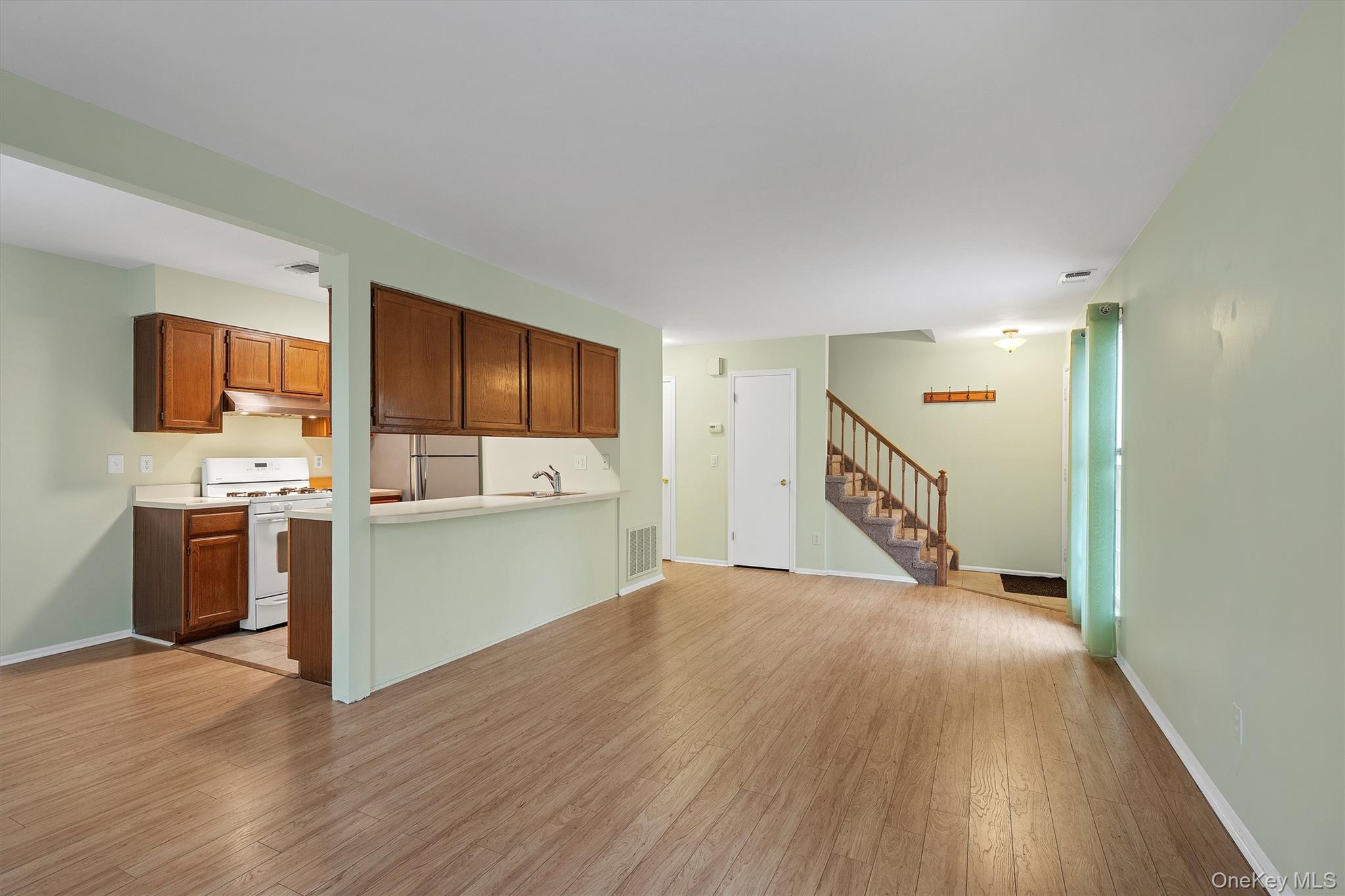 29 The Rise Warwick, NY 10990 - Photo 10 of 28 a view of a kitchen with a sink and a refrigerator