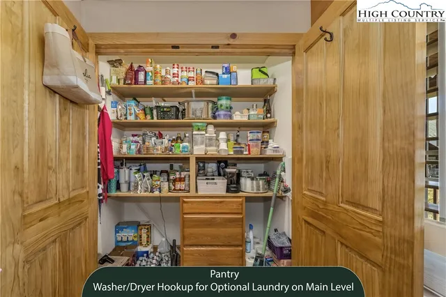 a bedroom with bed and wooden floor