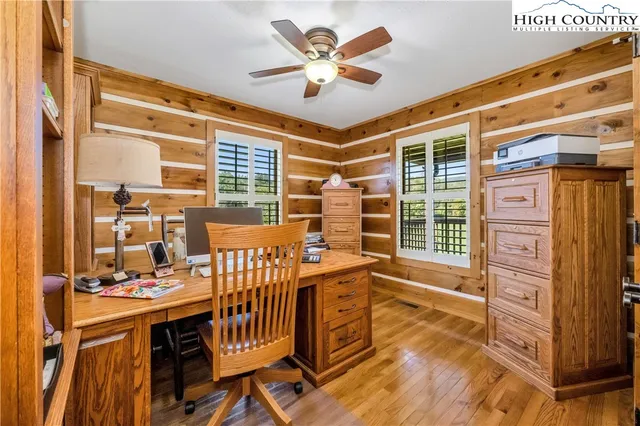 a bed room with a bed and a book shelf