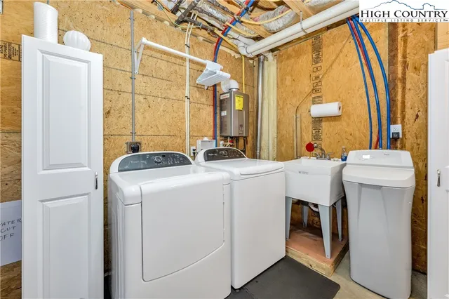 a view of a porch with furniture and next to a yard