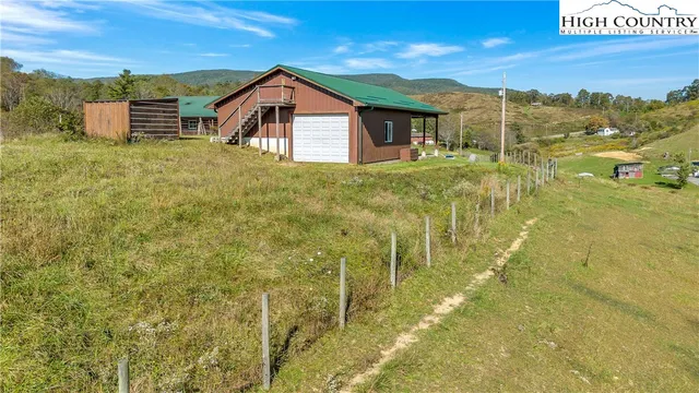 an aerial view of a house with a garden