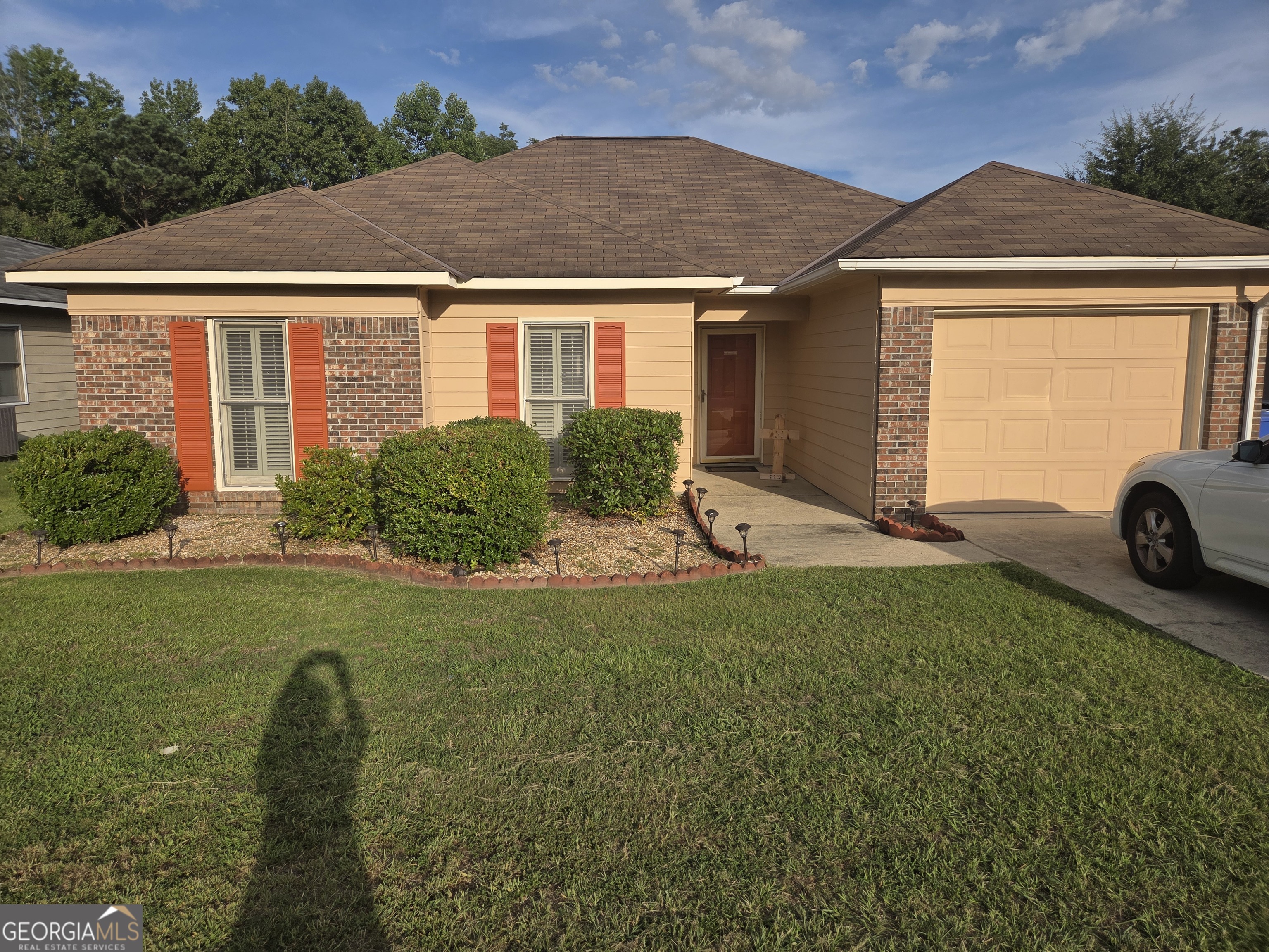 a front view of a house with a yard