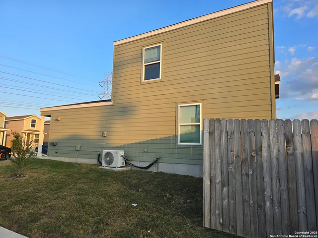 a view of a back yard of the house