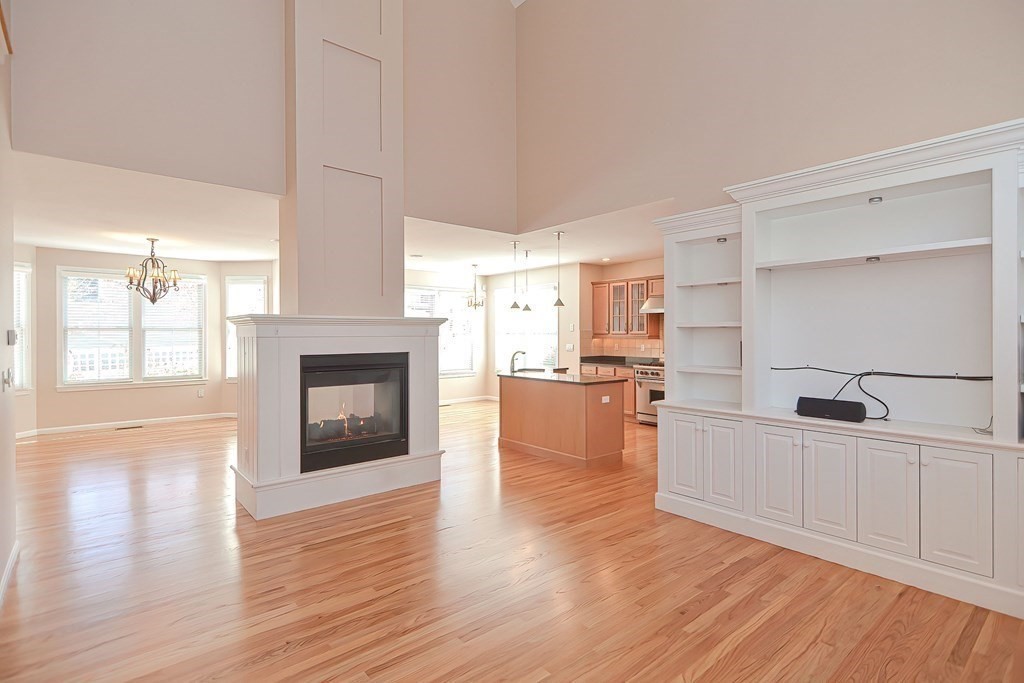 30 Codding Road, Unit 30 Norton, MA 02766 - Photo 11 of 40 a open kitchen with white cabinets and wooden floor