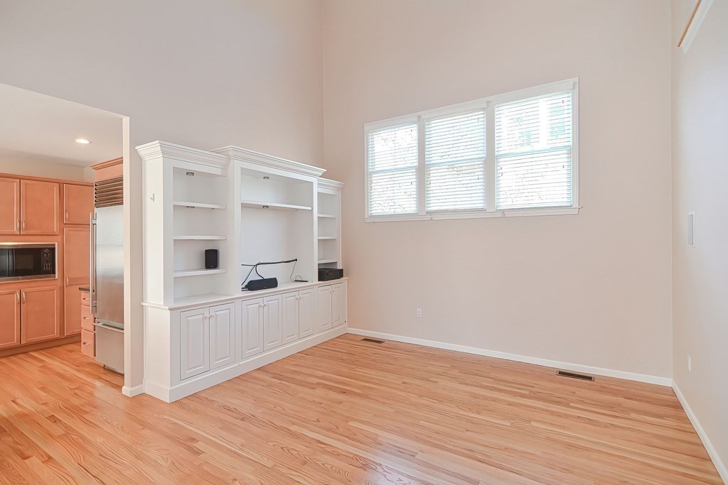 30 Codding Road, Unit 30 Norton, MA 02766 - Photo 12 of 40 a view of kitchen with wooden floor and electronic appliances